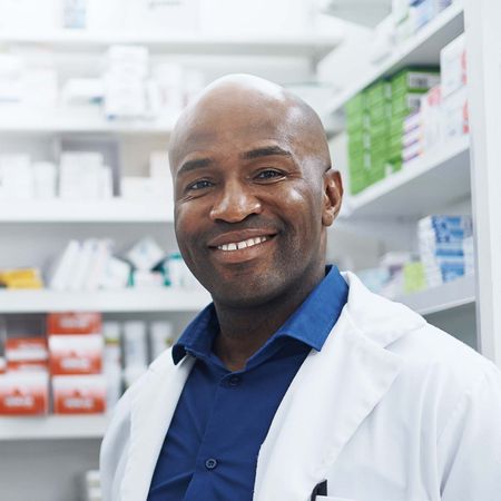 Pharmacist assisting a customer at the pharmacy counter